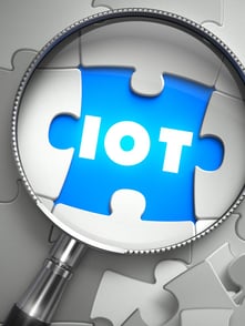 IOT - Word on the Place of Missing Puzzle Piece through Magnifier. Selective Focus..jpeg