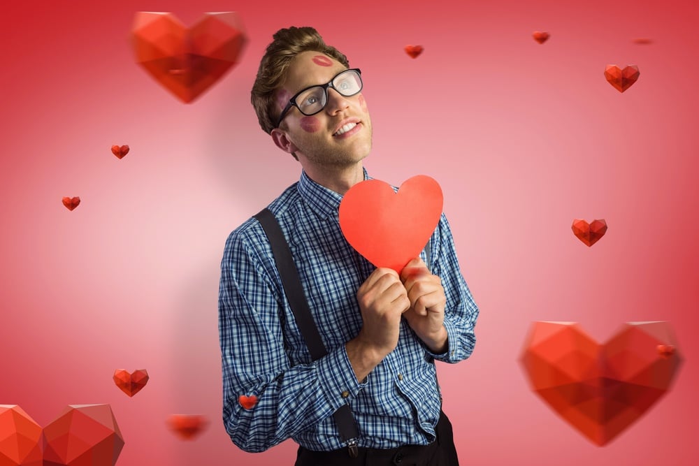 Geeky hipster covered in kisses against red vignette.jpeg